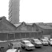 View from NNW showing part of NW front of central (E) block with part of central (N) block on right and tower block in background