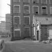 View from ESE showing part of ESE front of main block with part of small engine house in foreground