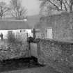 View from SW showing sluice with part of cottage in background