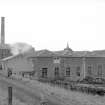 View from SSE showing SE front of S (E) block with part of chimney and S (W) block in background