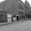 View from N showing WNW front and part of NNE front of Warehouses and Counting Houses with 280 George Street in background