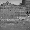 View from ESE showing ESE front of sawmill with part of warehouse on right and engine works on left