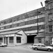 RCAHMS, 16 Bernard Terrace, Edinburgh. General oblique view of the street frontage of former C&J Brown's seen from the North West.