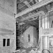 Interior view showing the front entrance hall of the RCAHMS under construction seen from the North West.