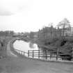 General view looking E showing canal at Luggiebank Road