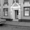 View from NW showing main entrance on NNW front
