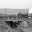 View from NNE showing trucks and NCB locomotive number 19 crossing bridge near washery