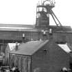View from SE showing ESE and SSW fronts of E building with headgear of number 7 pit in background
