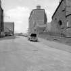 View from ESE showing part of SSW and ESE fronts of works with part of church on right