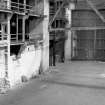 Interior
View showing part of strainer truss and side gallery with sliding doors in background