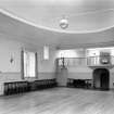 Interior-general view of St Cecilia's Hall, Edinburgh, showing gallery and large oval mirror over fireplace.