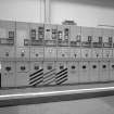Power house: auxiliary power switchboard.  English electric 2 megawatt 6.6 KV AC auxiliary switchboard, used to distribute AC power from the two alternators to all parts of the works.
Digital image of B 13387