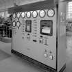 Power house: water flow (from Dam and sidestream) control panel.  Regulates water flow depending on the need for power in the cell room, which is supplied with D.C. from the 12 pairs of generator sets.
Digital image of B 13391