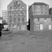 View from SSE showing SSE front of sugar refinery with part of numbers 73-75 on right