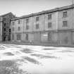 View from SE showing SSW front of E building with main building in background