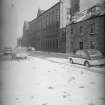 View from SW showing WNW front of S block of mill with number 16 Cotton Street in foreground