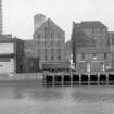 View from SSE showing part of SSE front of sugar refinery with warehouse and numbers 76-78 Regent Quay on right and part of Regent Shed on left