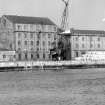 View from SW showing SSW front and part of WNW front of main building with E building on right