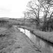 View looking NNW showing canal feeder at Craigmarloch with stables in background