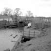 View from WSW showing W front of bridge with landing stage (used by the Fairly Queen until 1939) in foreground and part of cottages on left