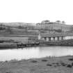 View from SSW showing S front of overflow with cottages on right