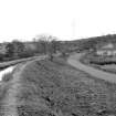 View looking SSE showing canal feeder at Craigmarloch with cottages in background