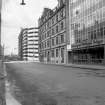 View from SE showing SSW front of warehouse with part of 28-32 Cadogan Street in foreground