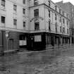 View from W showing SSW front and WNW front of numbers 22-30 Wilson Street with part of numbers 96-104 Brunswick Street on left
