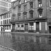 View from ENE showing ESE front of warehouse with number 63 in background