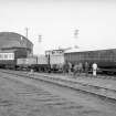 View from SSW showing coaches and locomotives with goods shed in background