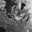 Excavation photograph : jawbone and hearth in central area of larger wheelhouse.