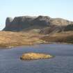Copy of colour slide showing dun on Loch nam Ban Mora with An Sgurr beyond. View from NW.
Digital Image only.