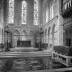 General view of altar with sarcophagus in foreground
