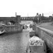 View looking WSW showing ENE front of bascule bridge with bridge in background and part of basin in foreground