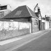 View from N showing WNW front and part of N front of booking office