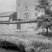 View from S showing part of SSE front of main block.