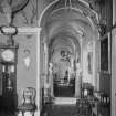 General view of entrance hall and corridor decorated with antlers at Yester House, East Lothian.
