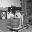 Interior.
Weighing machine, grain measure and levelling-off roller.
Digital image of A 33439.