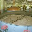 Mash House: view from NE of two Mash Tuns, No 1 open (foreground) and No 2 with copper cover (and ventilation to roof).
Digital image of C 24080 CN.