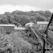 View looking SSE along conveyor with surface buildings in background