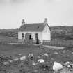 General view of front of Mission House.
