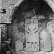 Oronsay Priory, interior.
View of arch in north side of chancel with effigy beneath.
