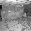 Stable, (former steading), interior view of East end showing Caithness slabs.
Digital image of D 31006