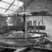 One of three detailed interior views showing remains of flint grinders on upper floor (with tobacco tin for scale)
Digital image of B 10004/6