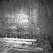 View showing dividing wall in 2 chamber Newcastle kiln with flues at ground level
Digital image of B/9493/1
