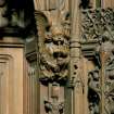 Detail of carved angel playing bag-pipes, to east of main doorway, Thistle Chapel, Edinburgh.