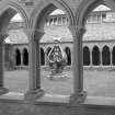 Iona Abbey, cloister. Cloister and statue.