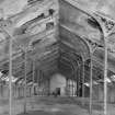 Interior.
View of top flat of mill from East showing ornate perpendicular gothic cast iron roof trusses.