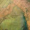 Oblique aerial view of Ettleton Sike centred on the remains of a farmstead, field-system, rig and boundary banks with further boundary banks and rig adjacent, taken from the ENE.