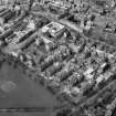 Scanned image of oblique aerial view from South East showing Lauriston Place, the Royal Infirmary and George Heriots Hospital School. Includes Chalmers Street.